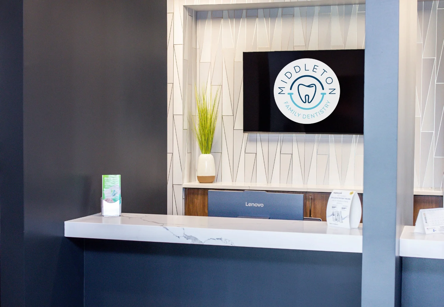The welcoming reception desk and waiting area at Middleton Family Dentistry's new Oak Court office.